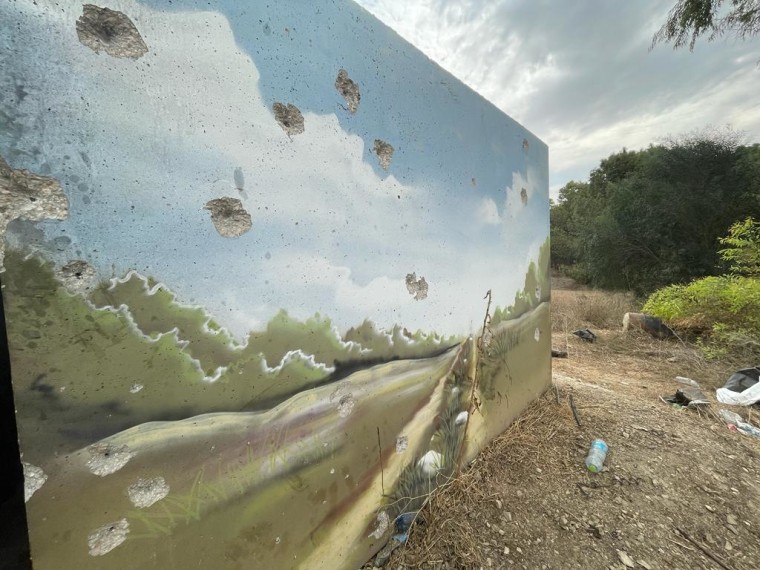 Bullet holes mark a concrete shelter across from the fields where at least 260 people were killed at a music festival near Re'im, Israel.