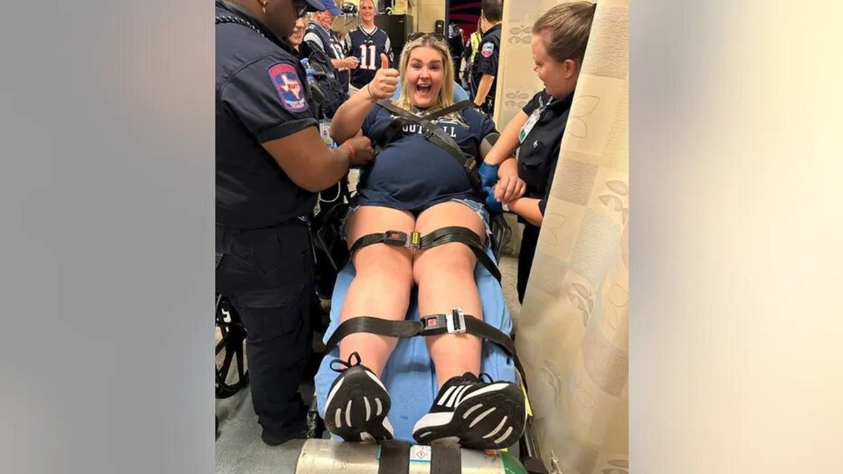 A Dallas Cowboys fans attends a game