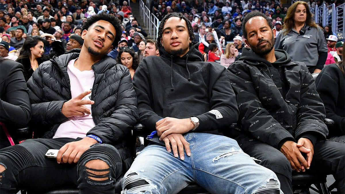 Bryce Young and CJ Stroud attend an NBA game