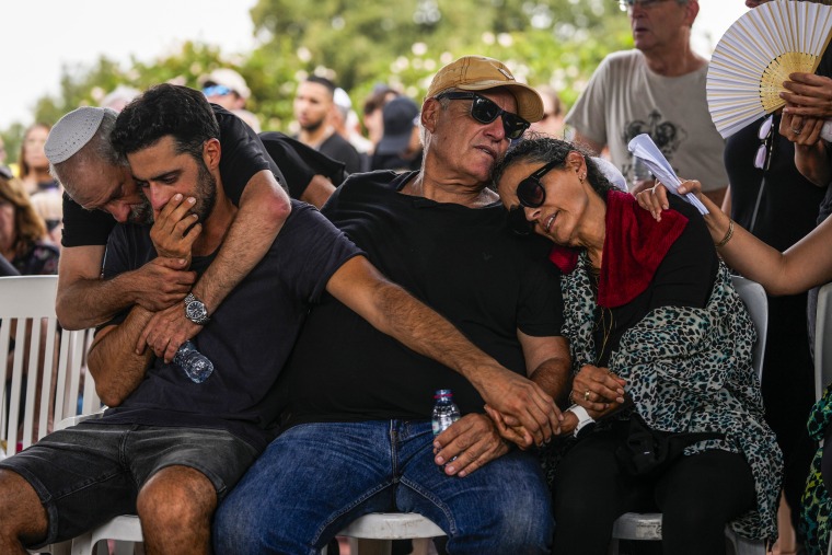 Mourners attend the funeral of May Naim, 24, in Gan Haim, Israel.