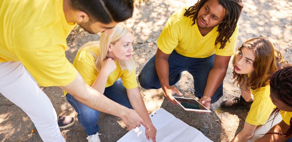 Group of Friends on a Treasure Hunt with Map