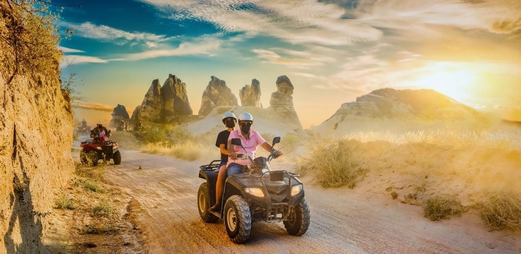 ATV Quad bike in front of mountains landscape sunset inTurkey.