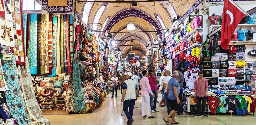 Large oldest covered market with different fabric products and cloths sell and crowded people. 