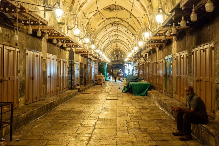 A walk through old Jerusalem feels like strolling through a city abandoned. Most of the tourist shops around the holy sites are shuttered for lack of tourists. Food stalls and shops selling basic essentials are open but with fewer customers than usual.