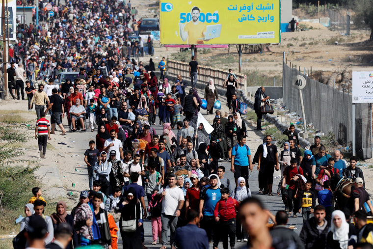 Palestinians flee north Gaza towards the south, amid the ongoing conflict between Israel and Palestinian Islamist group Hamas, in the central Gaza Strip