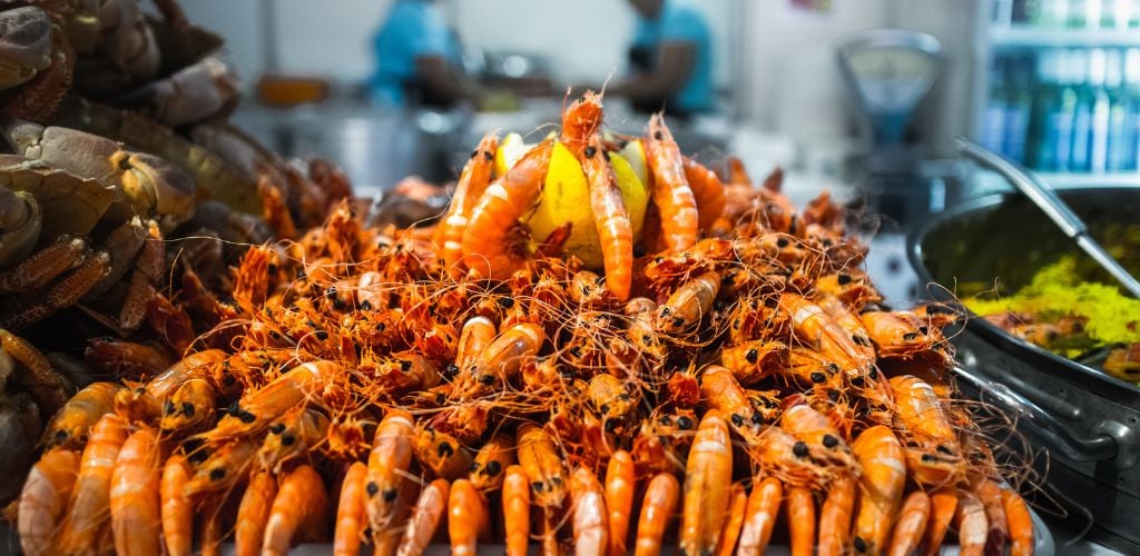 Table with seafood full of prawns and crabs during the festival. 