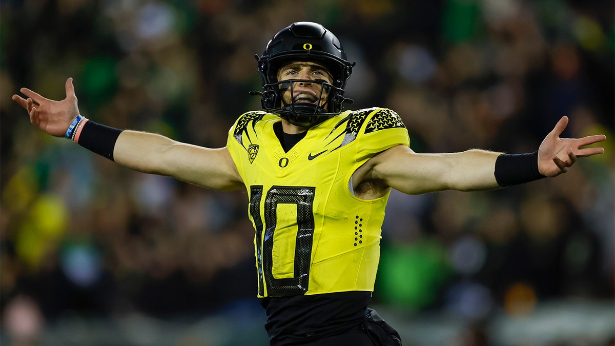 Bo Nix celebrates against USC