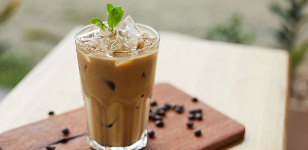 Iced Latte Coffee in a glass with cold milk. 