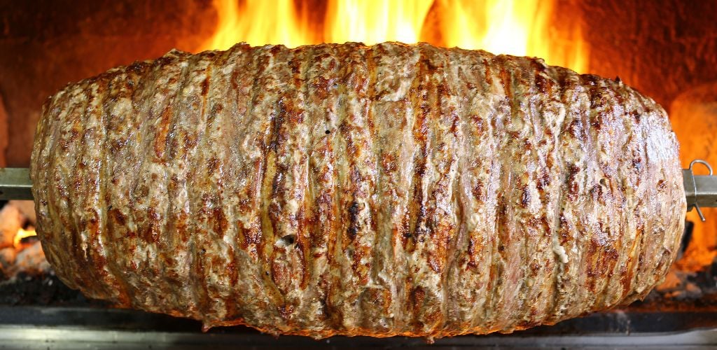 A firewood-cooked meat roll