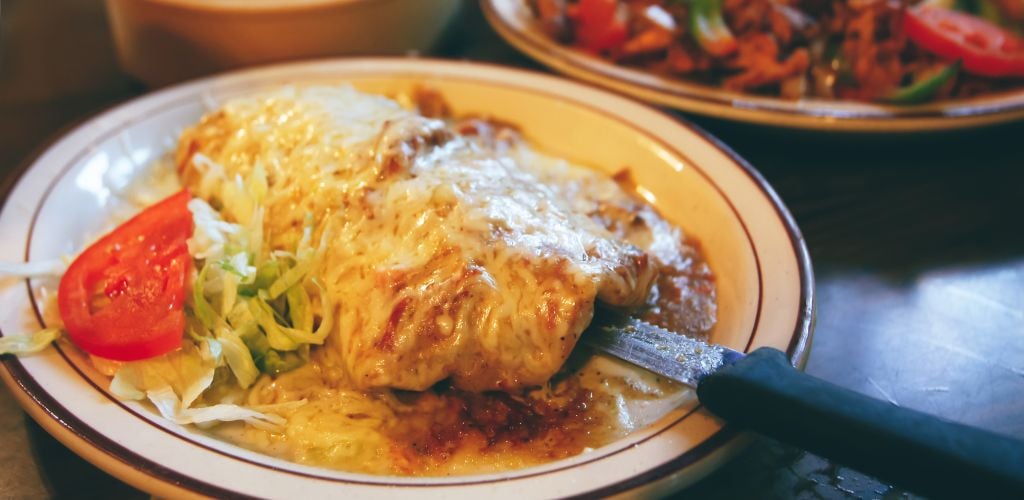 Traditional Mexican Food. Cheesy Enchilada, fajita, flour tortillas.