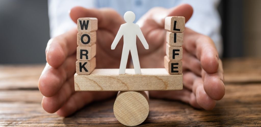 Human Work-Life Balance Protection Concept Using a Wood Letter Block and a Paper Shape