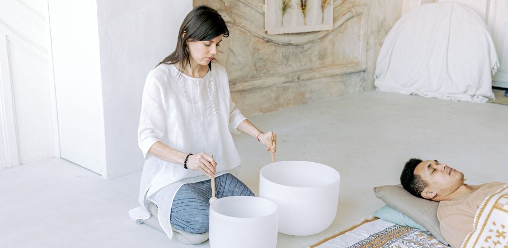 Woman Using Tibetan Singing Bowls