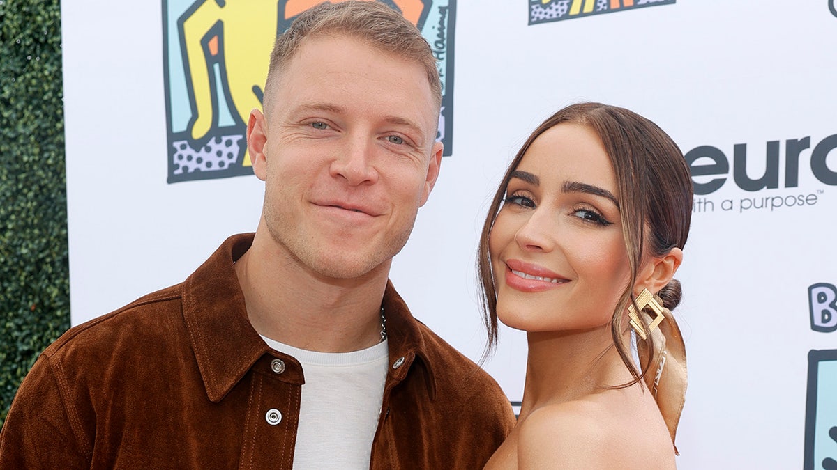 Christian McCaffrey and Olivia Culpo