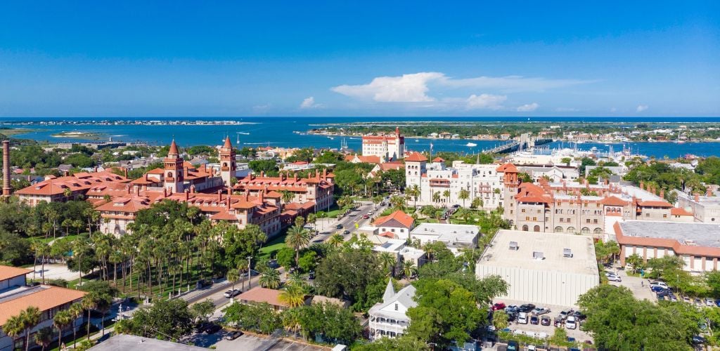 Aerial drone view of historic St. Augustine, Florida where in a lot of building structures and a river lake. 