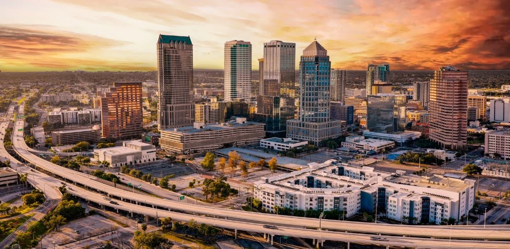 City Skyline and long road of Tampa under the sunset. 