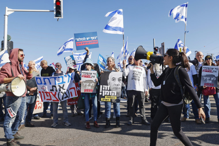 Israelis evacuated from northern areas near the Lebanese border due to ongoing cross-border tensions, rally near the northern Amiad Kibbutz, demanding to return home, on Dec. 26, 2023. 