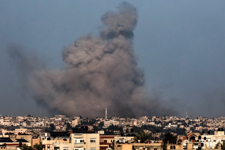  A smoke plume erupts over Khan Younis, Gaza, during Israeli bombardment on Dec. 26, 2023.