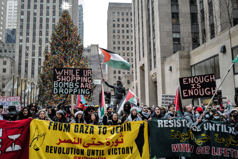 Protesters demonstrate in support of Palestinians at Rockefeller Center in New York on Dec. 25, 2023.
