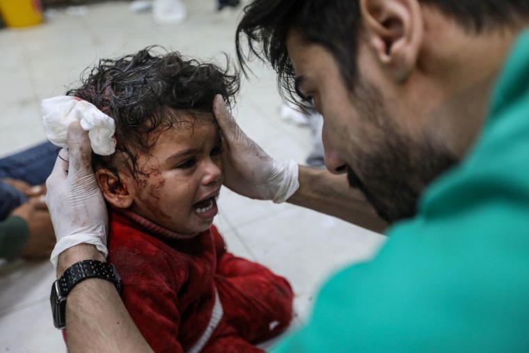 An injured Palestinian child is treated at Nasser Medical Hospital on Dec. 26, 2023 in Khan Younis, Gaza.