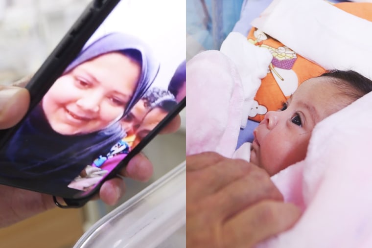 Hanan Beyouq looks at her baby, Najwa, via a video call from the Makassed Hospital in East Jerusalem on Sunday. 
