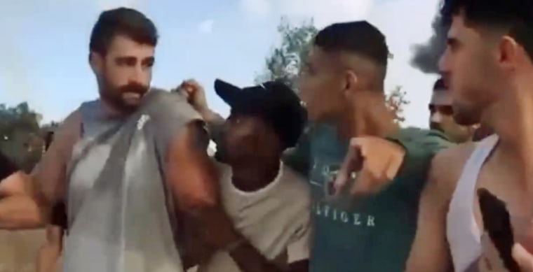 A still from video shows Avinatan Or as he appears to be captured In Israel by a group of men on Oct. 7, 2023.