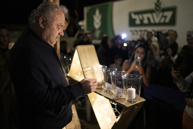 Hanukkah is Judaism's "festival of lights." On eight consecutive nightfalls, Jews gather with family and friends to light one additional candle in the menorah.(AP Photo/Leo Correa)