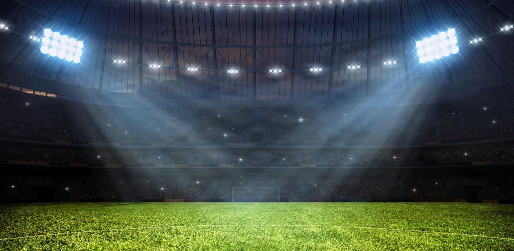 Soccer football stadium with floodlights.