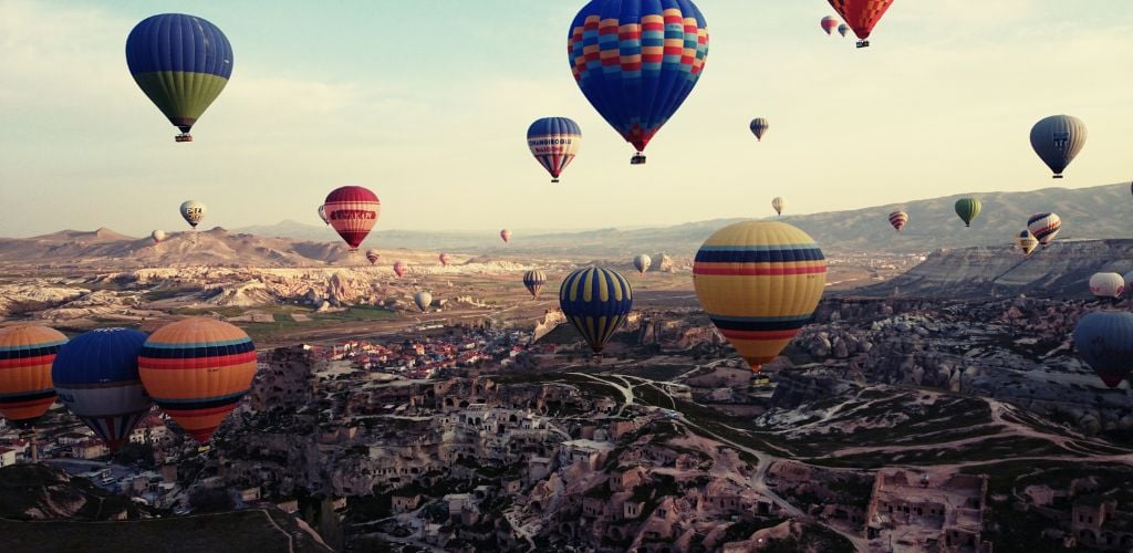 There are a lot of colorful hot air balloons above Cappadocia.