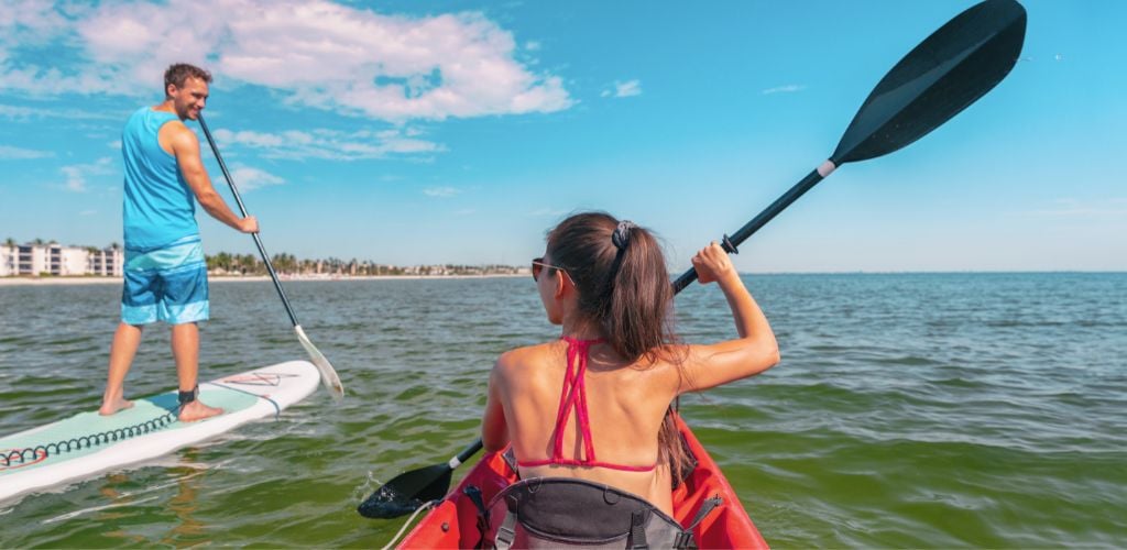 Couple Kayaking and Paddle Boarding Fitness Man in Ocean Paddleboard Beach People on Stand-up Paddle Boards Surfing