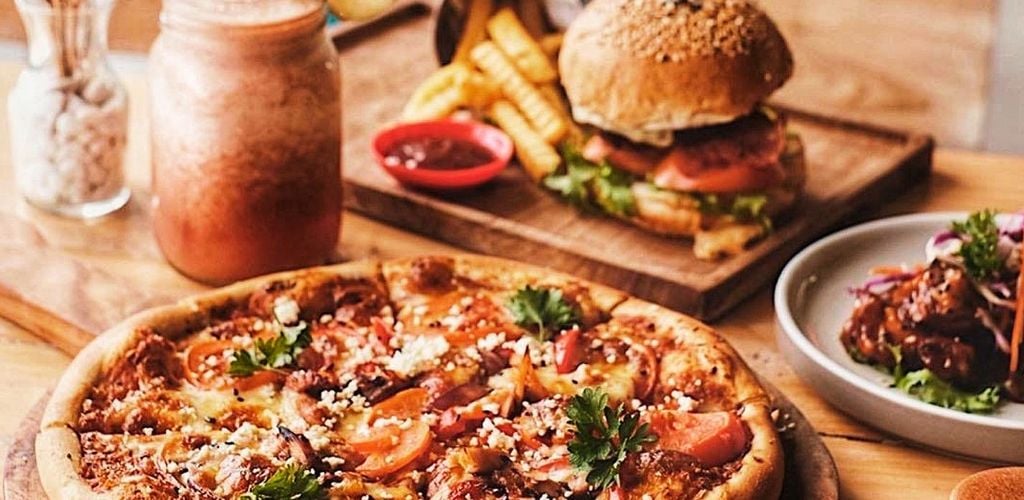 smoothies, burger with fries and pizza. 