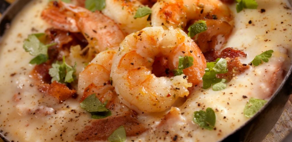Creamy grits with shrimp, bacon, and fresh parsley. 