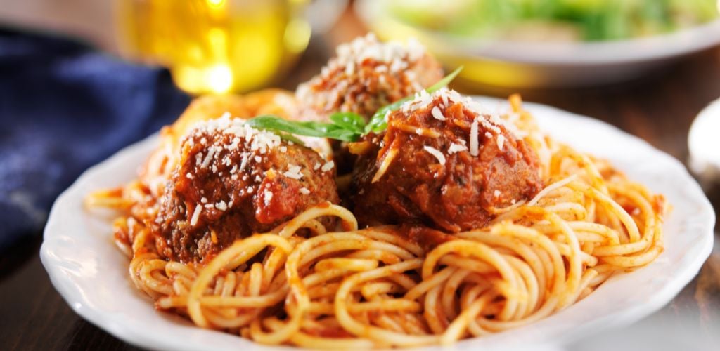Spaghetti and Meatballs Dinner on a white plate.
