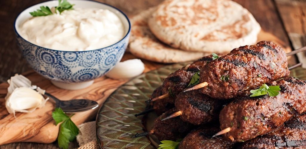 Lamb kababs with cool sauce and pita