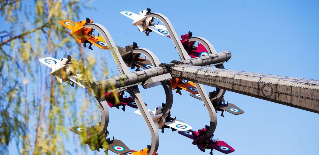 Riding on an Attraction in the Form of an Airplane. Amusement Park in Turkey