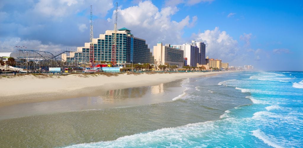 Daytona Beach in Florida Coastline. Buildings and amusement parks at a distance. 