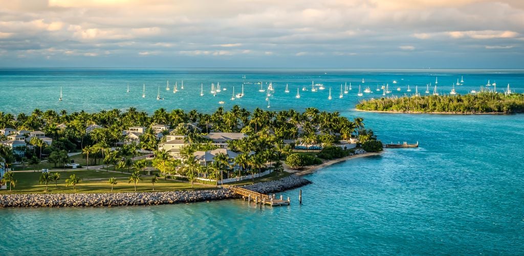 Panoramic sunrise landscape view of the small Island Sunset Key and Wisteria Island of the Island of Key West, Florida Keys. 