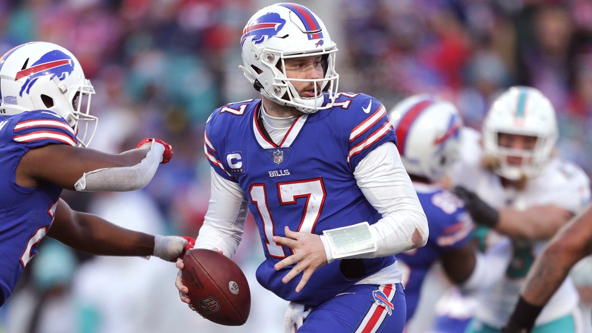 Josh Allen drops back to pass