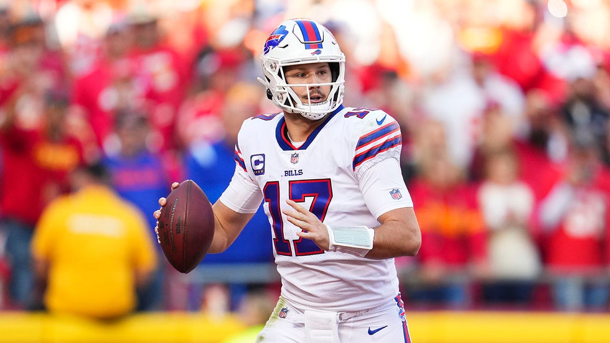Josh Allen looks to pass during a game