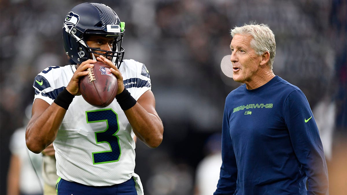 Pete Carroll and Russell Wilson before a game