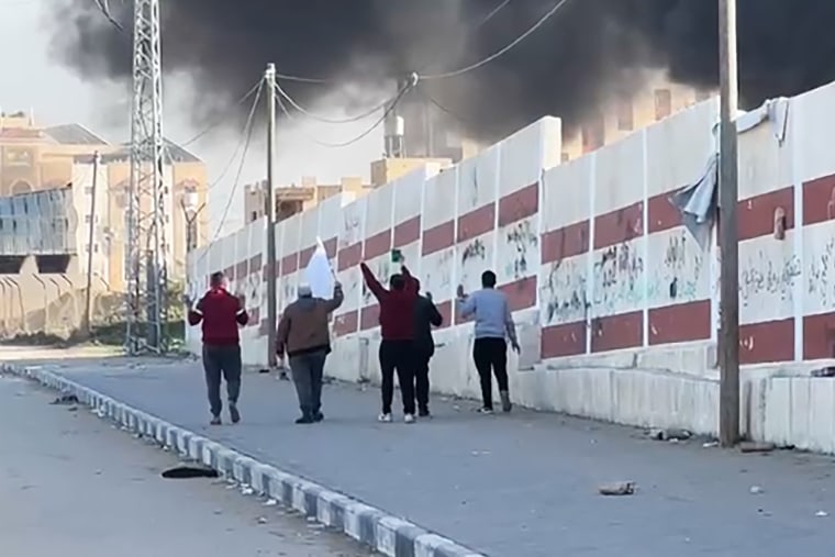 Palestinian shot waving white flag