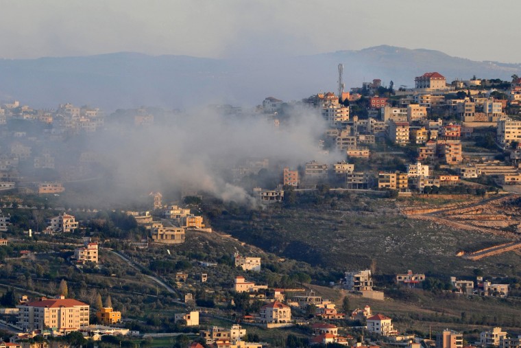 Smoke rises over buildings on the outskirts of the southern Lebanese border village of Khiam following a reported Israeli bombardment on Jan. 7, 2024.
