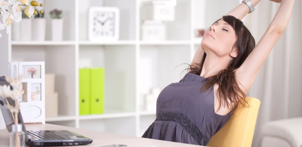 Woman streatching during a work break 