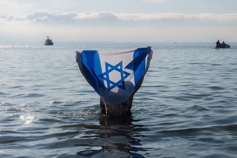 A person holding an Israeli flag during the Polar Bear Plunge in Coney Island on Jan. 1, 2024 in New York City. 