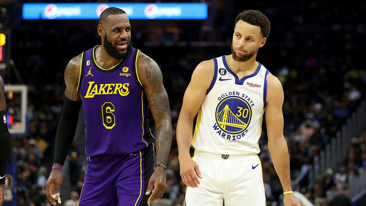 LeBron James and Stephen Curry on the court during a game