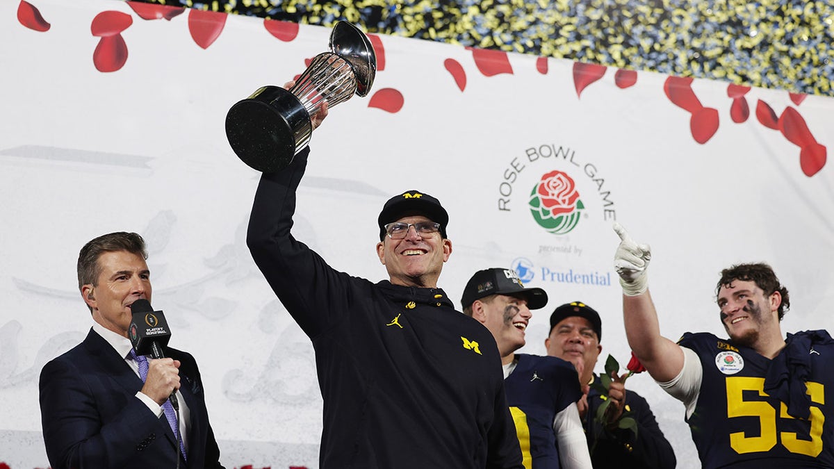 Jim Harbaugh celebrates winning the rose bowl