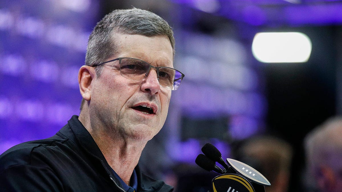 Jim Harbaugh speaks during a press conference