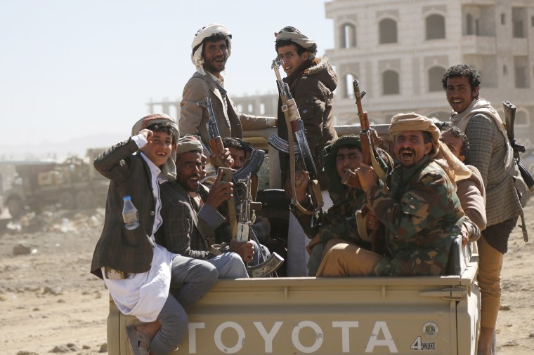 Houthi fighters and tribesmen stage a rally against the U.S. and the U.K. strikes on Houthi-run military sites near Sanaa, Yemen, on Sunday, Jan. 14, 2024.