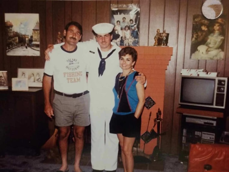 Gilbert Wyand with his parents during his time in the Navy.