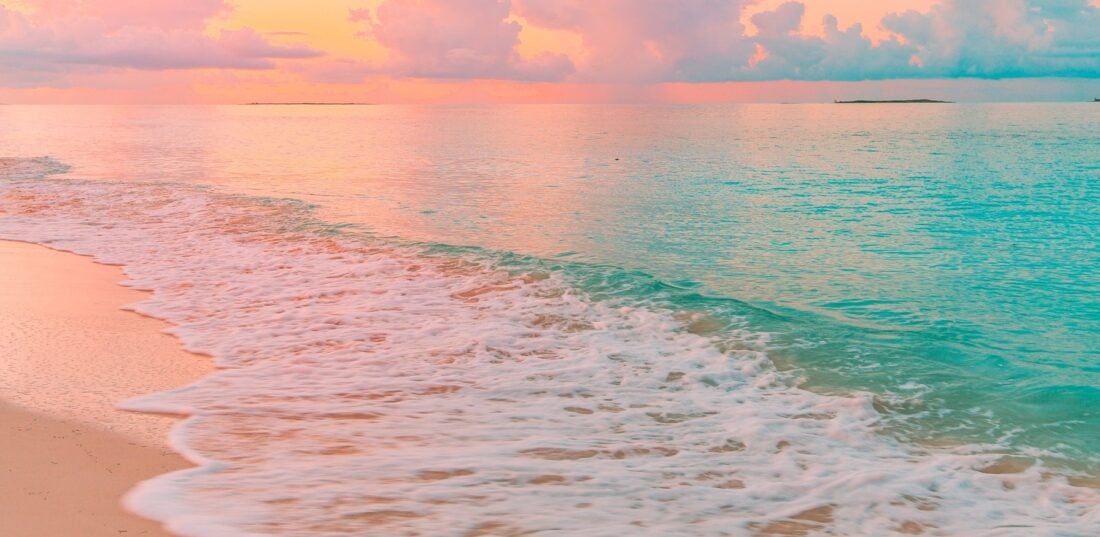 Sunset at the Beach with clear blue water. 