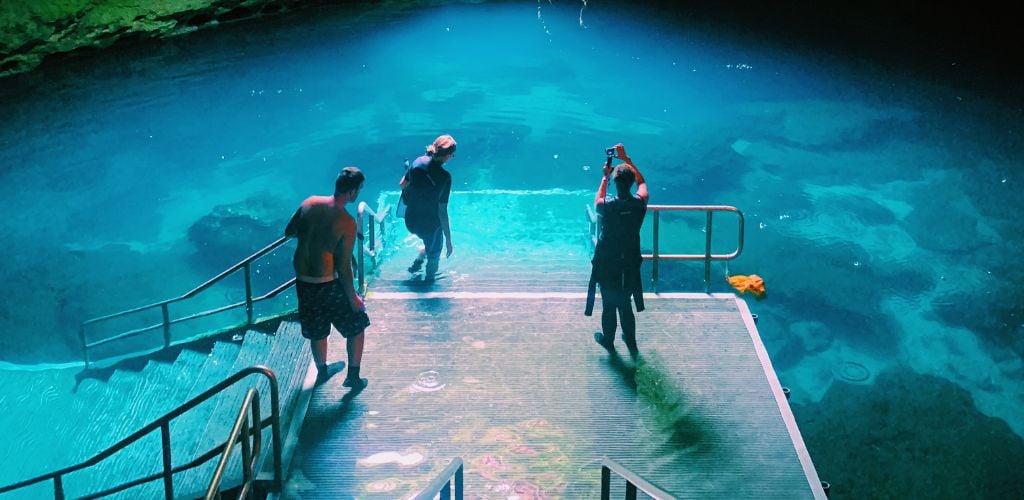 Three divers at the Devils Den Spring